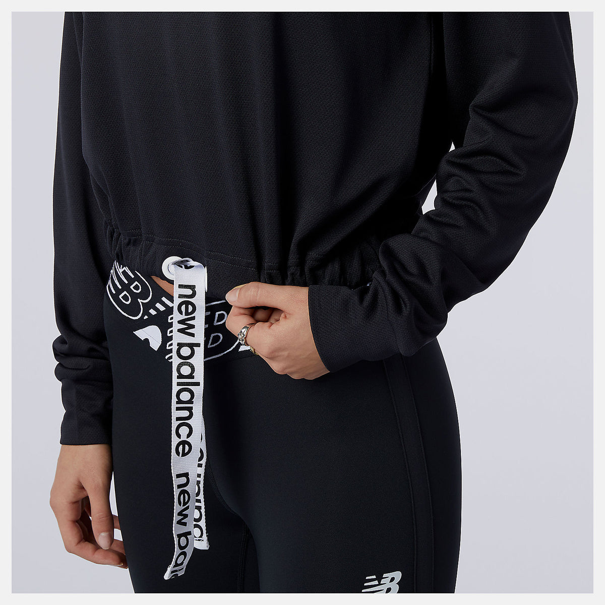 Women New Balance Relentless Cinched Hem Hoodie